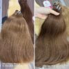 Wholesale Machine Weft Hair #6 Brown Extensions 12 Inch (30cm) | 100% Best Raw Human Hair Factory 6 Close-up inspection of Sheen Hair Vietnam's Machine Weft Hair #6 Brown Extension
