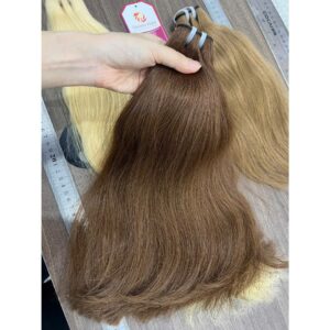 Close-up inspection of Sheen Hair Vietnam's Machine Weft Hair #6 Brown Extension