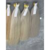 Bulk Blond Hair Extensions: 7 Unbeatable Reasons Salons Buy in 2026 9 Raw vietnamese hair factory worker inspecting 613 bulk hair extensions 70 cm