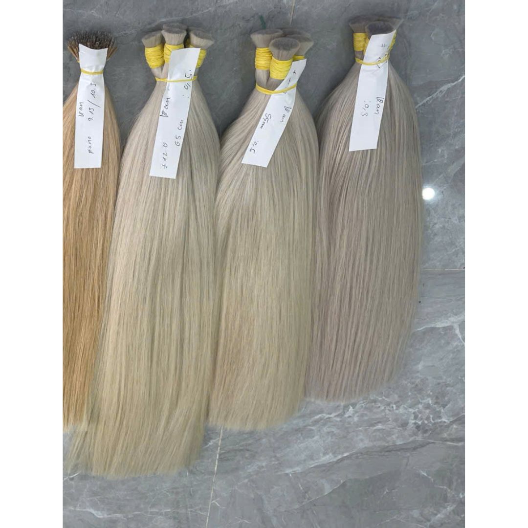 Bulk Blond Hair Extensions: 7 Unbeatable Reasons Salons Buy in 2026 11 Raw vietnamese hair factory worker inspecting 613 bulk hair extensions 70 cm